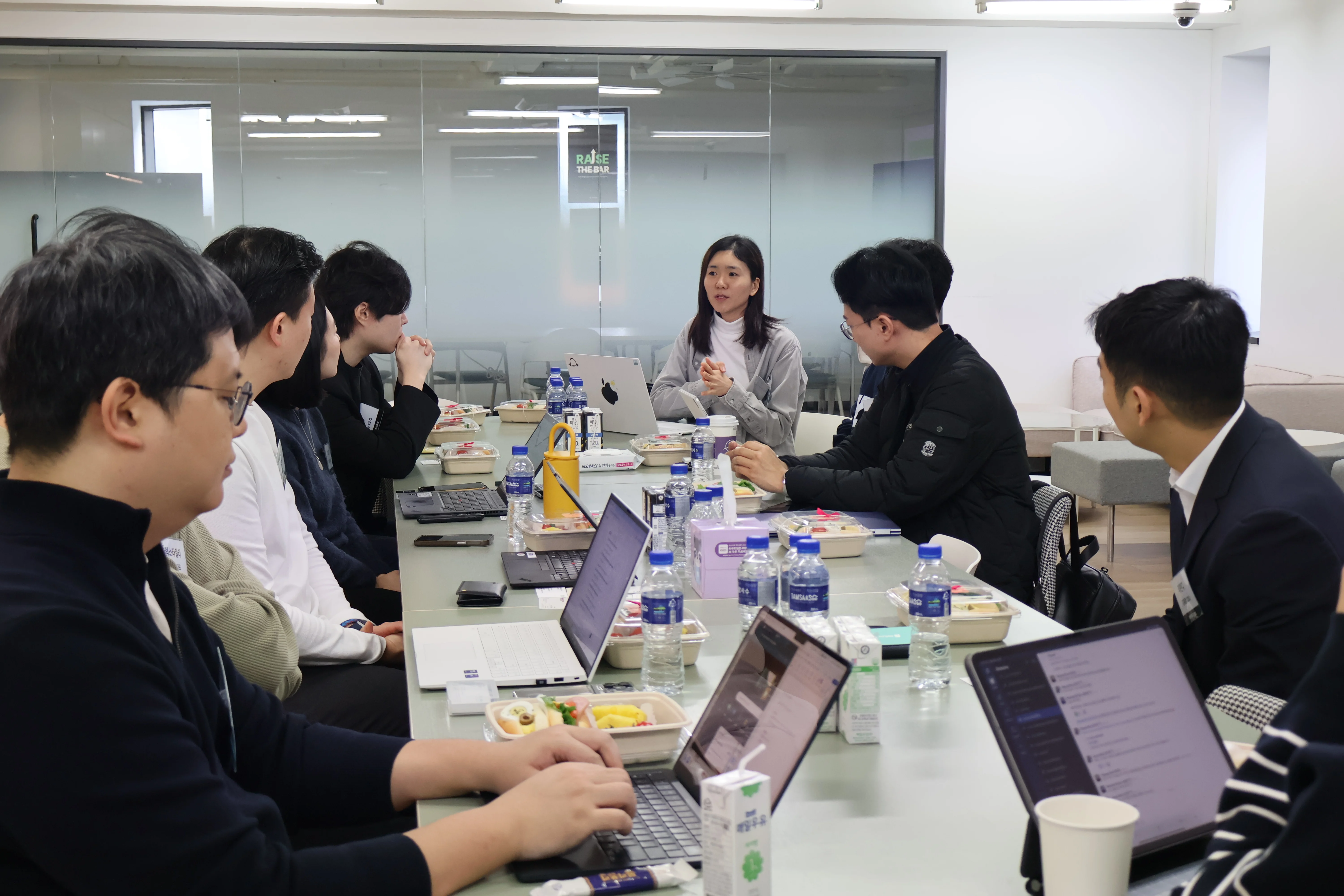 Korean professionals participating in a business meeting